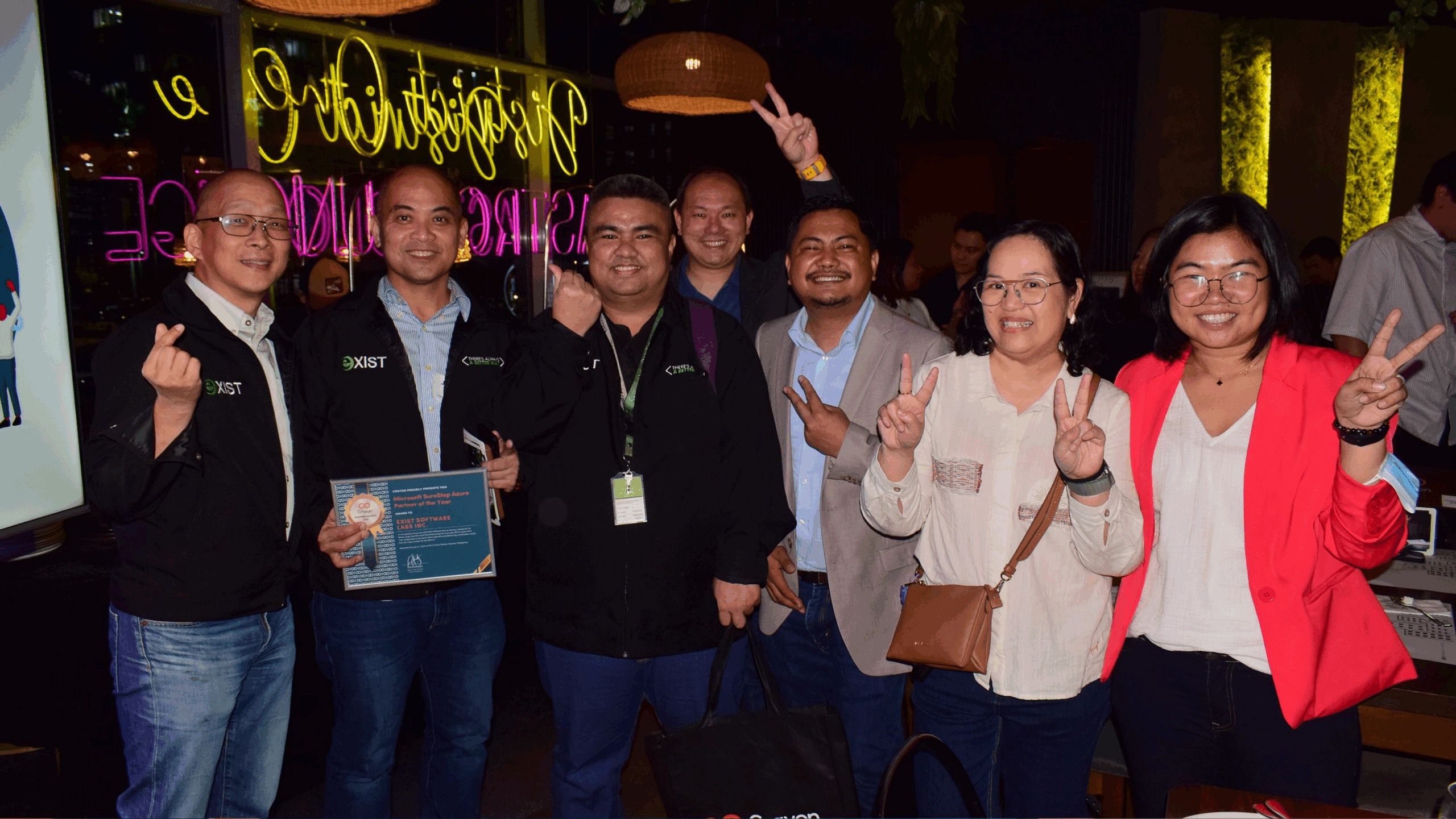 Exist Software Labs team posing with Crayon Philippines team for 2025 Microsoft SureStep Azure Partner of the Year