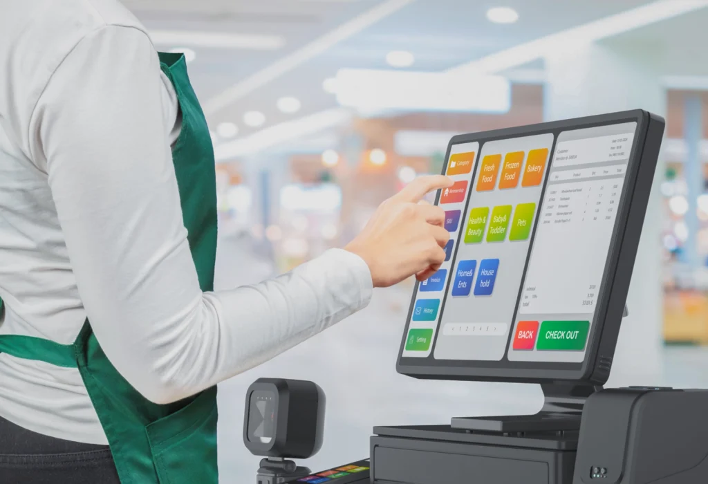 Touch screen point of sale system or cash register machine on retail desk grocery store