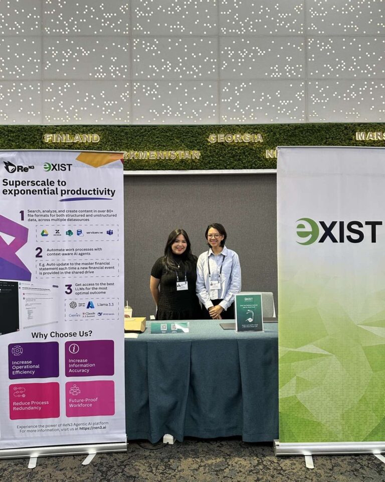 Two employees of Exist behind an event booth at the ADB Asia Pacific Digital Transformation Forum 2025